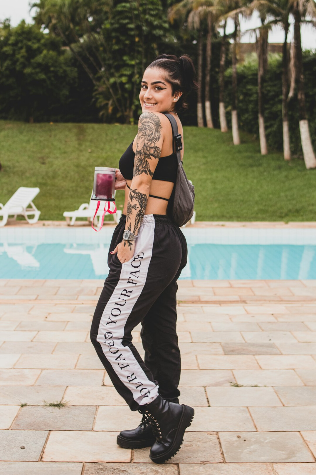 Brazilian woman smiling confidently while giving a thumbs up