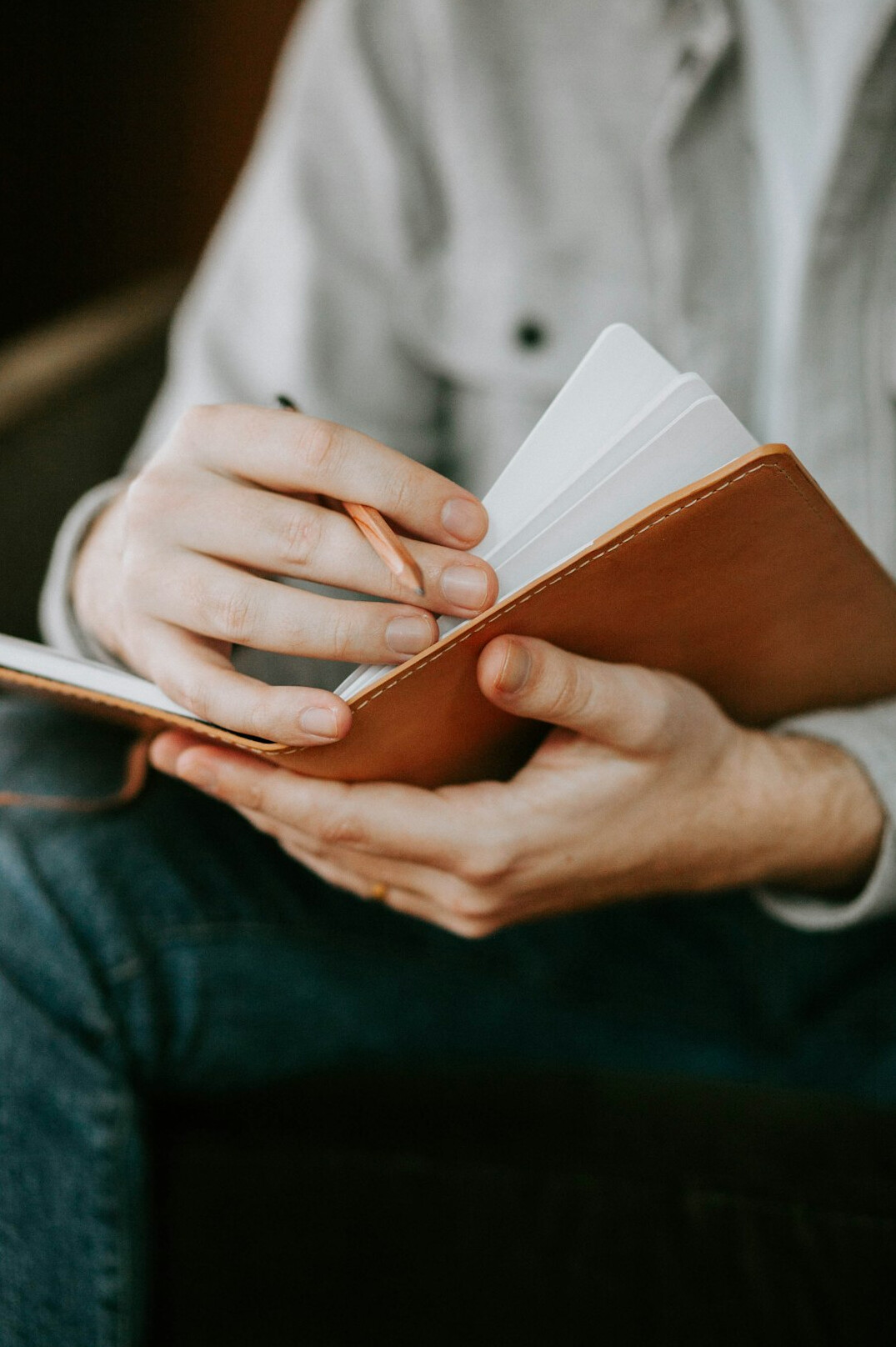 person writing journal